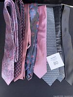 All eight ties side by side showing patterns and colours