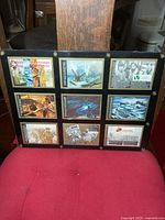Front view of framed set showing all nine cards
