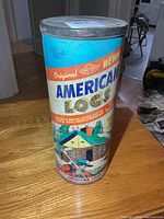 Full view of American Logs cylindrical canister