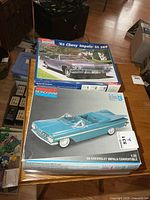 Both model kit boxes stacked showing front artwork and titles