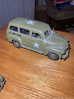 driver side view of diecast army truck showing star and unit number