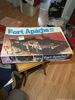 Lid view of Fort Apache play set box on table