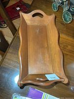 Top view of cherry wood tray showing shape and hand-grip openings