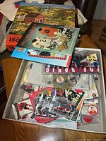 Overview of box with books on top and contents visible