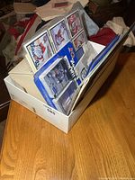 Shoebox containing binder, cards, book and papers