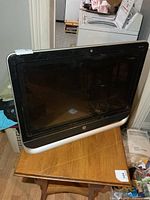 Front view of HP all-in-one desktop on table