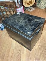 Full view of metal storage box showing top and side