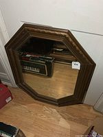 Front view of octagonal wood framed mirror