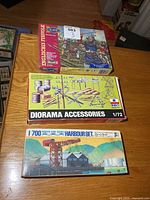 All three model kit boxes stacked