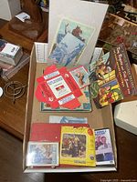 Overall view of tray with records, books, cassettes, cards and View-Master packet