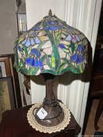 Full view of lamp on table showing shade and base