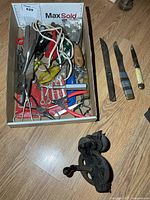 Overall view of tray contents and knives plus separate bench grinder