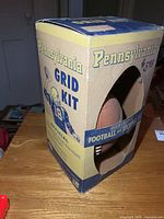 Front view of boxed Pennsylvania Grid Kit showing football through window