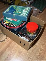 Box with multiple vintage board games visible