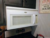 Microwave installed above stove, front view