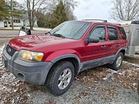 Front left view of red 2005 Ford Escape