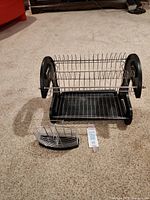 Front view of chrome two-level dish rack with drip tray and utensil holder