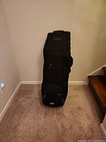 Full view of closed Bag Boy travel cover standing upright