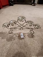 Front view of five-candle silver candelabra showing overall structure