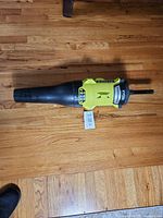 Full view of Ryobi jet fan blower attachment on hardwood floor