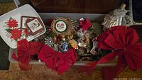 Open tub showing bows, tray, ornaments, angel