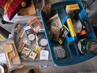 Overall view of two tote organizers with packaged and loose hardware