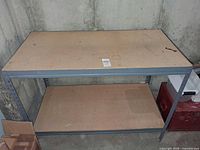 Front view of boltless metal workbench showing two shelves and overall structure