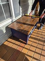 Coffee table top measured with tape for length