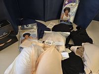 Overview of all bras and silicone bra box on table