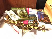 Box with travel guides, pamphlets and bumper sticker