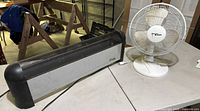 Slant/Fin heater and Hawaiian Breeze fan on table overview