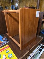 Table on its side showing wood grain and finish