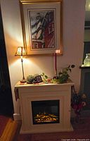 Front view showing electric fireplace lit with flame effect