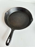 Top view of 10.5" cast iron skillet showing interior surface and handle