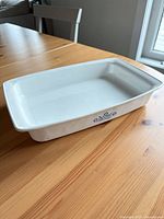 Side view of baking dish showing blue cornflower motif