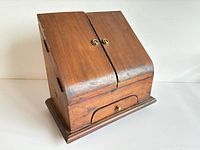 Closed wooden stationery box front view