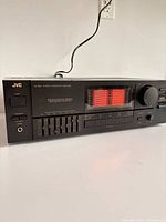 Front view of JVC AX-S95X amplifier showing control layout