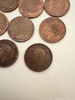 Group of circulated Canadian pennies showing obverses and reverses