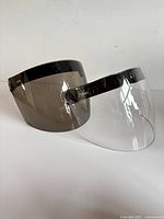 Front view of both visors showing smoke tint and clear versions
