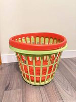 Close view of green basket showing side slats and interior