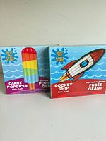 Front view of both incrediblle pool float boxes showing designs