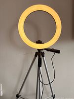 Ring light illuminated warm on tripod