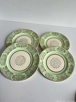 Front view of all four plates showing pattern and two sizes