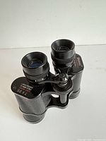 Overall view of Tasco binoculars standing upright