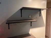 Two wall mounted shelves showing full view