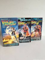 Front view of three Back to the Future VHS tapes standing upright showing cover art