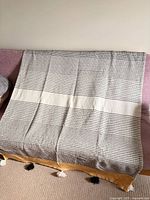 Full view of blanket draped on sofa