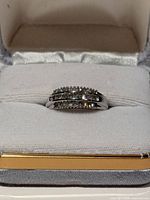 Front view of diamond baguette ring in box