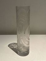 Full front view of tall clear crystal vase showing overall cylindrical shape and swirl design