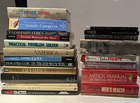 Two stacks of assorted books, health titles on right, sports and reference titles on left